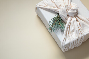 Zero waste gift wrapping traditional Japanese furoshiki style. Sustainable design concept....
