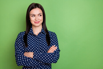 Photo of confident brunette hairdo agent lady crossed arms look empty space wear blue shirt isolated on green color background