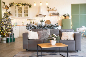 Modern Kitchen Interior with Island, Sink, Cabinets in New Luxury Home Decorated in Christmas Style