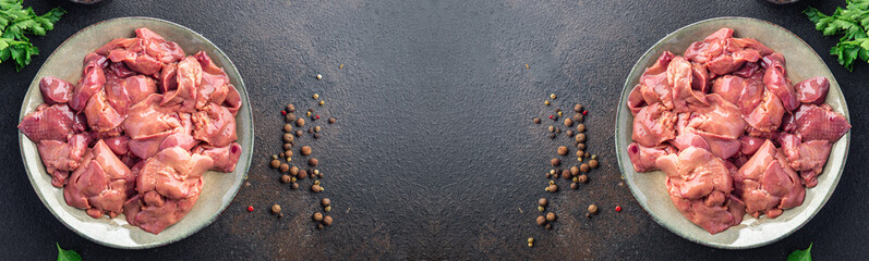 raw chicken liver offal piece meal snack on the table copy space food background rustic. top view keto or paleo diet