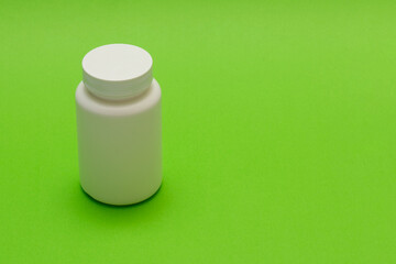 plastic white bottle with pills