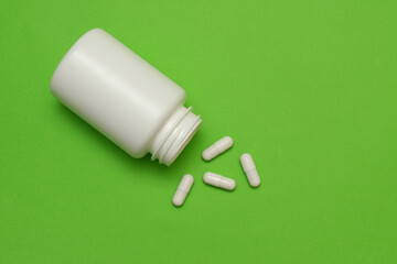 plastic white bottle with pills
