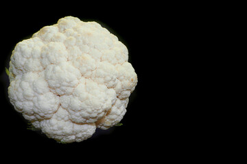 raw cauliflower on a black background. kind of super