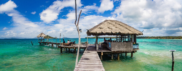 Wooden beach bar in sea and hut on pier in koh Mak island, Trat, Thailand