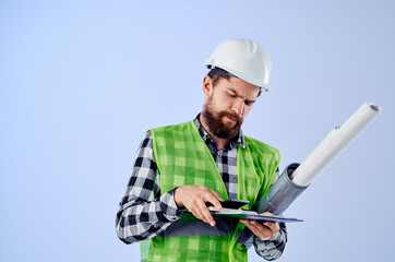 engineer with documents and drawings blueprints isolated background