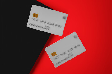 Two credit cards on red and black background. Bank cards mock up, 3d illustration. Online shopping and digital money concept