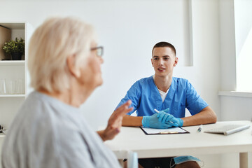 elderly woman patient is examined by a doctor health care