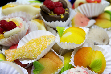 Selection of colorful traditional Portuguese almond marzipan cakes.
