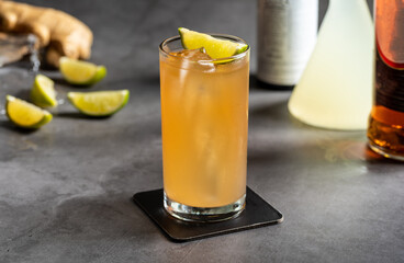 Luxury cocktail and cocktail shaker on black stone background
