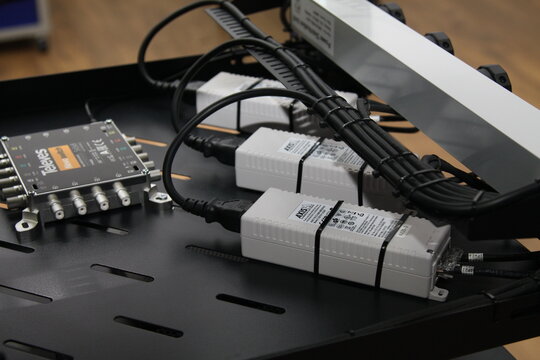 Axis PoE injectors for video surveillance cameras installed in a low-current rack.