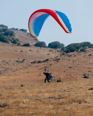 Paraglider Pilot Flying in the Sky - 467008814