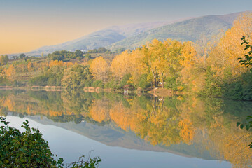 A pond in Samsun/Turkey. A very beautiful autumn landscape. Reflection, mountain, sky and colorful trees.