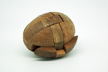 Wooden puzzle egg. Brain gymnastics. Complicated wooden puzzle in egg shape