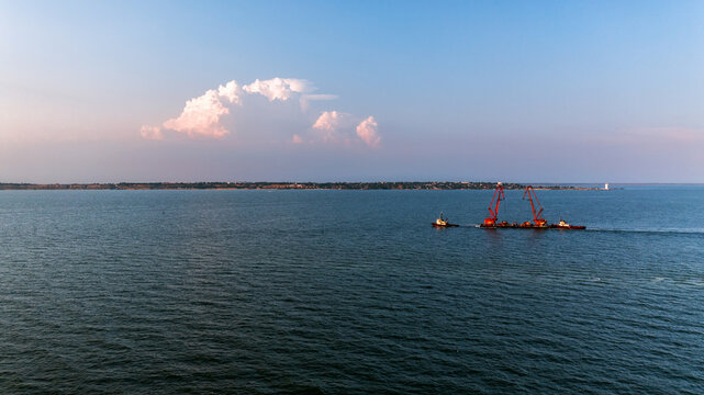 Black sea in Ukraine. Kinburn Spit. Sunset and ship in sea