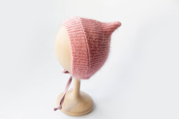 Fototapeta premium pink knitted hat and diaper for baby