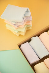 Multi-color socks lying on colourful background