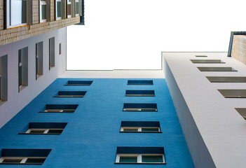 Photo of the blue white building corner with sky