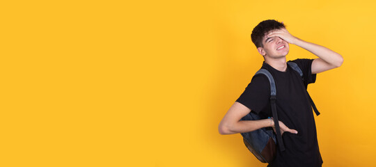 isolated student with backpack with back pain