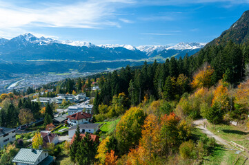 Fototapeta na wymiar Alpine landscape in Innsbruck, Tyrol, Austria on October 18, 2012. Trees and mountains.
