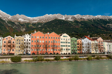 Fototapeta na wymiar Innsbruck, Tyrol, Austria. Colorful houses and river inn on a sunny day with blue sky on october 18, 2021.