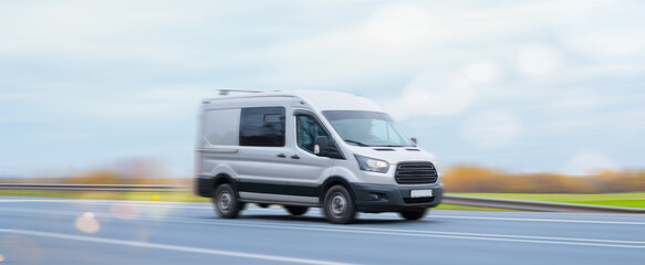 The minibus goes on a suburban highway