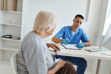 elderly woman at the doctor's appointment health care