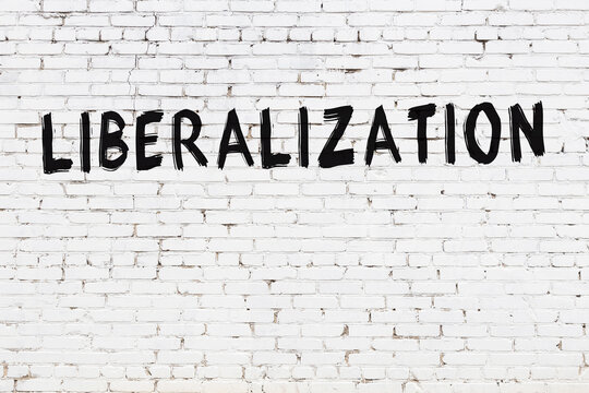 White wall with black paint inscription liberalization on it