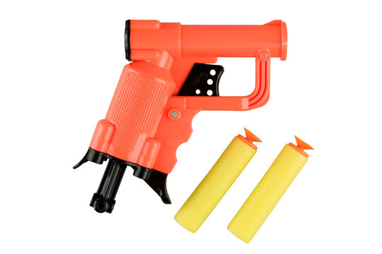Toy pistol with soft bullets on suction cups, isolated on a white background