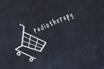Chalk drawing of shopping cart and word radiotherapy on black chalboard. Concept of globalization...