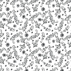 Hand-drawn black and white seamless winter pattern with curls and snowflakes. Vector illustration for wrapping paper, greeting cards and invitations. 