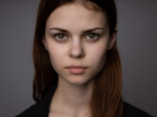 Fototapeta premium woman with serious facial expression hairstyle closeup