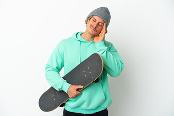 Young skater blonde man isolated on white background with headache