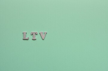 The letters arranged in the word LTV It's an abbreviation for Life Time Value. Copy space available.