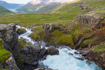 Naklejka na ściany i meble River Fjardara in Seydisfjordur fjord in Iceland