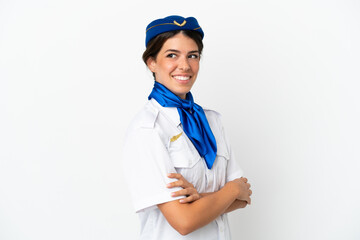 Airplane stewardess caucasian woman isolated on white background with arms crossed and happy
