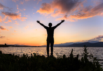 Silhouette of a man by the sea