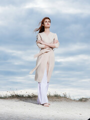 woman walk along the beach sand tropics elegant style