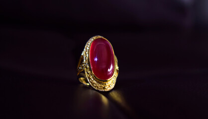 Ruby ring is a gold ring decorated with red ruby.