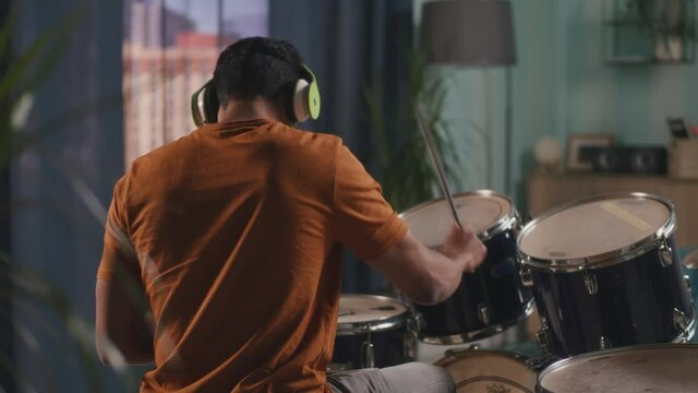 Indian man playing drums in evening