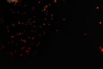 Macro shot of orange particles on black background