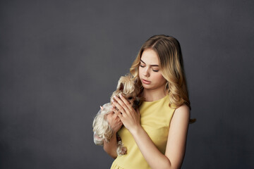 woman with a small dog makeup posing cropped view fashion