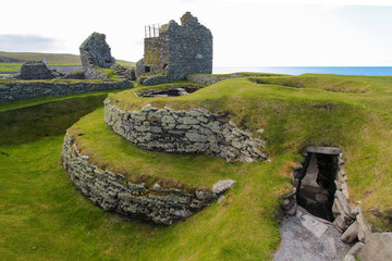 Iron Age wheelhouse in front of Laird's House at the Jarlshof Prehistoric and Norse settlement in...
