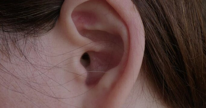 Close Up Pan of a Woman's Ear