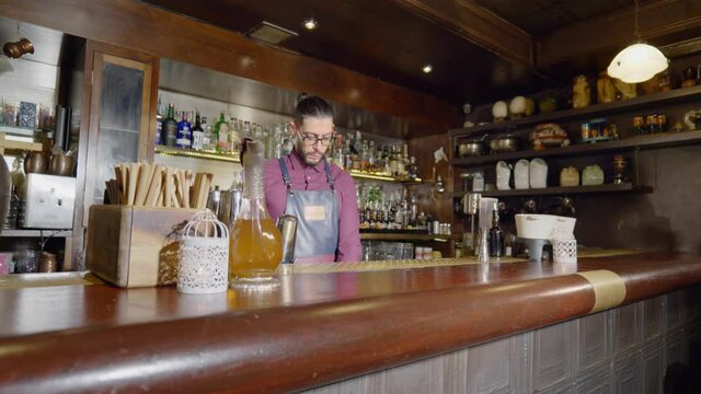 A bartender started preparing his cocktail