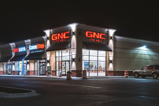 UTICA, NY, USA - NOV 21, 2019: A Night Exterior View of GNC Vitamin Nutrition Store, Located on 765 Horatio St, Utica, NY 13502.
