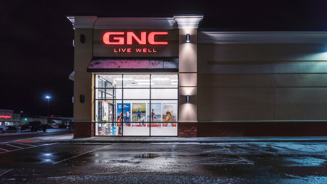 UTICA, NY, USA - JAN 01, 2020: A Night Exterior View of GNC Vitamin Nutrition Store, Located on 765 Horatio St, Utica, NY 13502.