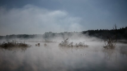 water vapor over the lake, fog forming over the lake
