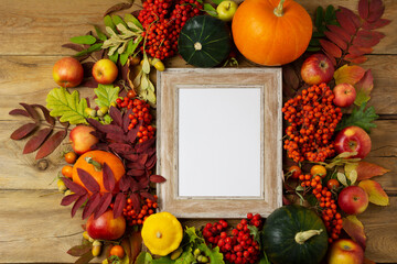 Wooden small frame mockup with pumpkins and fall leaves