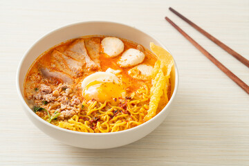 egg noodles with pork and meatball in spicy soup