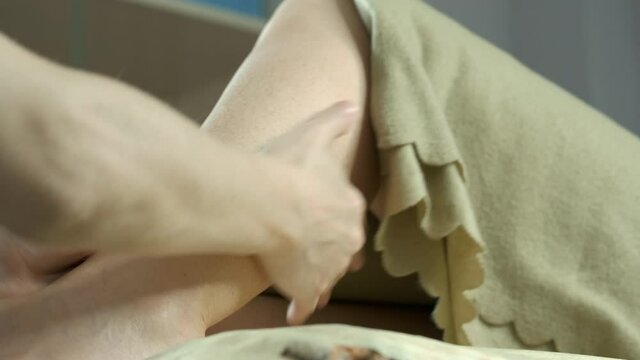 Foot care. Closeup female master hands making foot reflexology massage at beauty spa salon woman therapist massaging feet practicing healthy relaxing procedure or treatment.